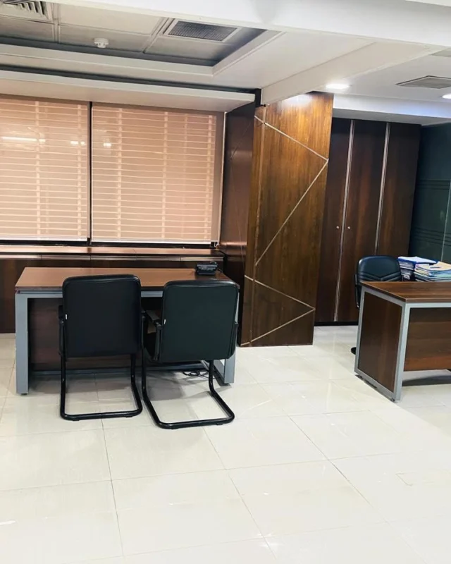 Executive office with walnut veneer paneling, geometric detailing and built-in storage