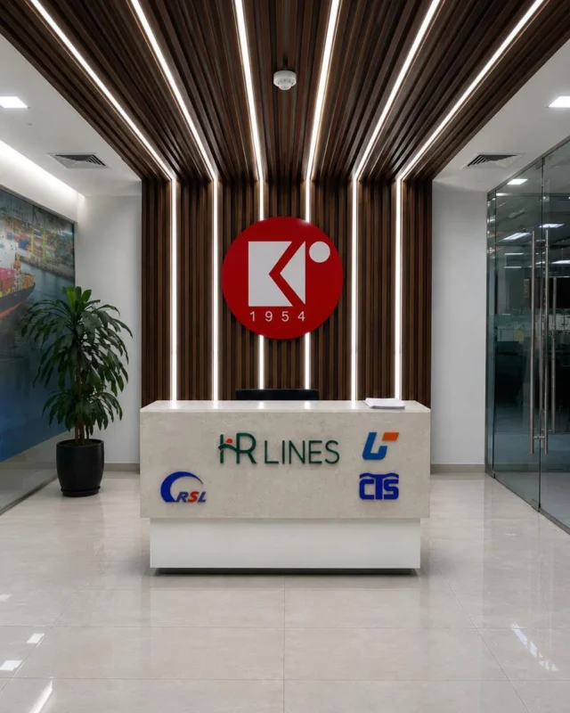 Reception desk with HR Lines, CTS and RSL branding beneath a backlit wood slat ceiling